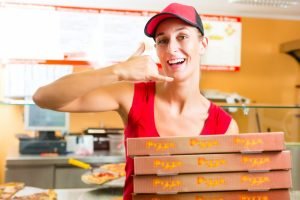 Woman her newly opened pizza franchise