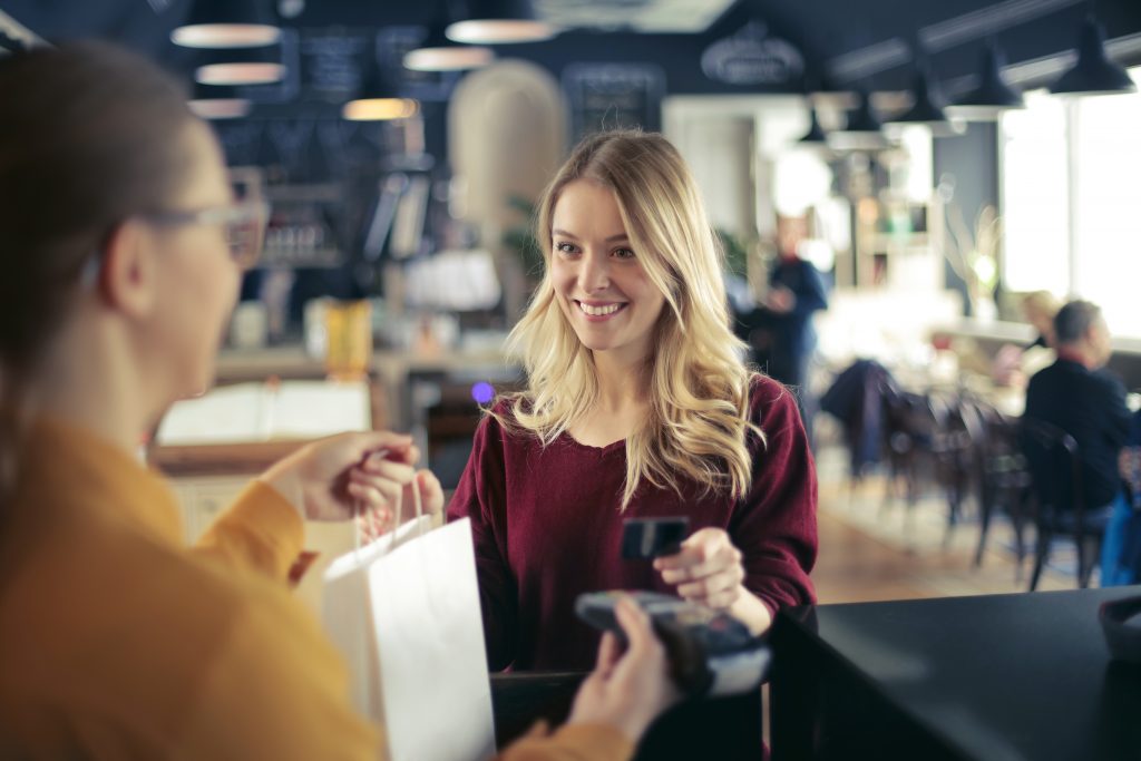 Lady paying with credit card for a purchase