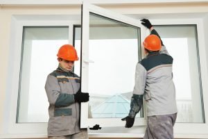 Men installing glass window