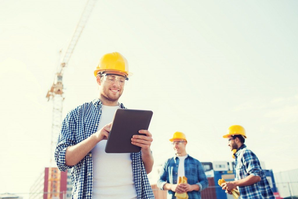 construction worker checking the list