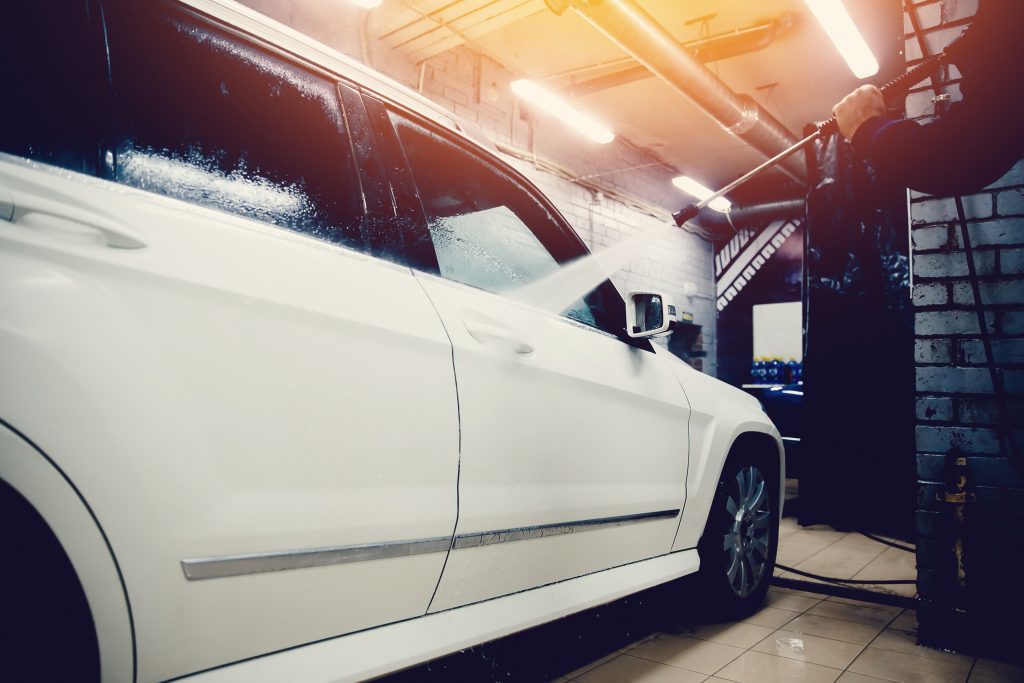 Car with tint being washed