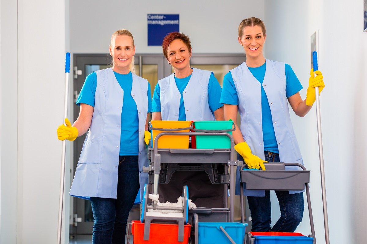 Group of women with cleaning tools