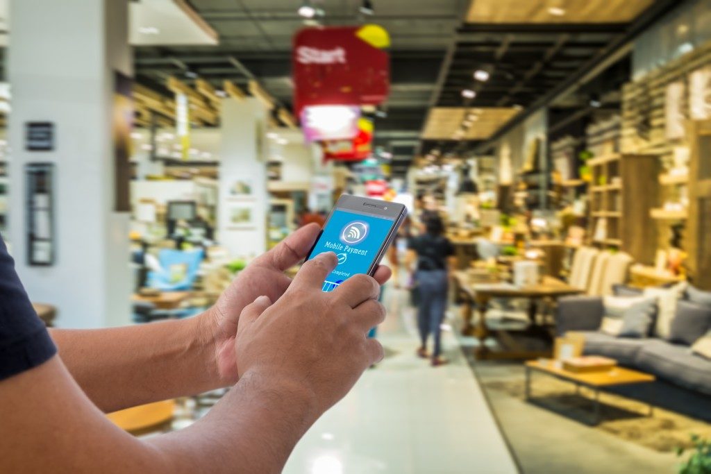 Man using NFC in the store