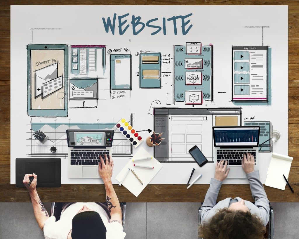Web developers designing website structure