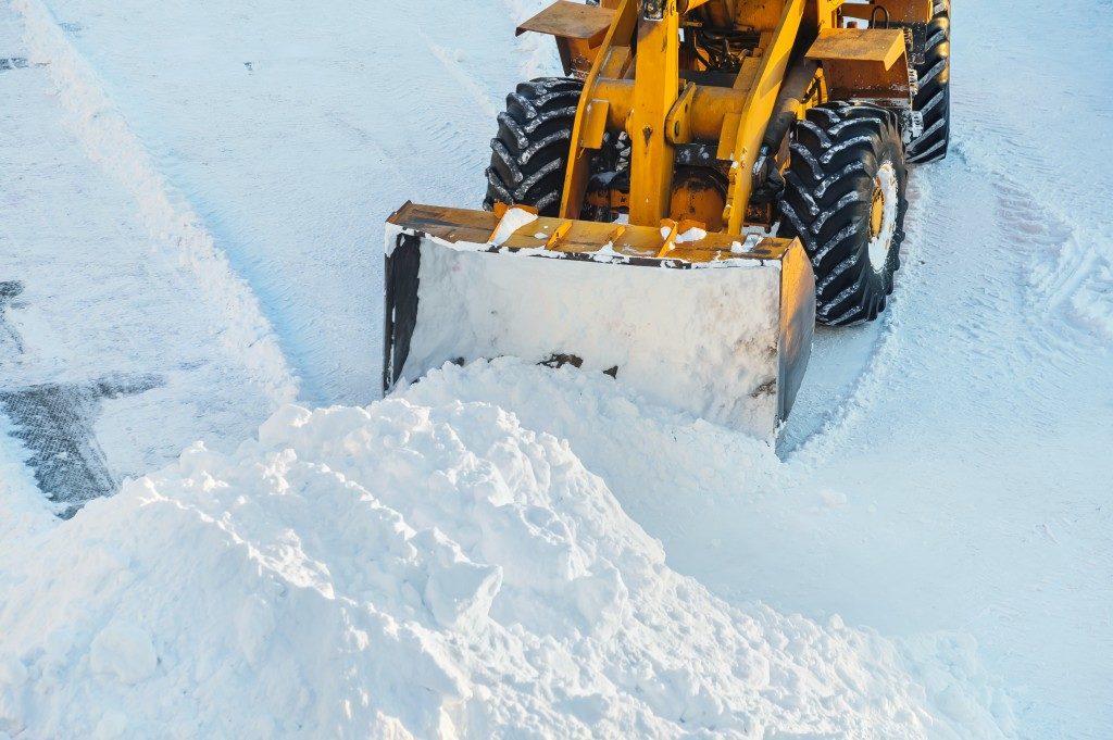 Tractor clearing the snow