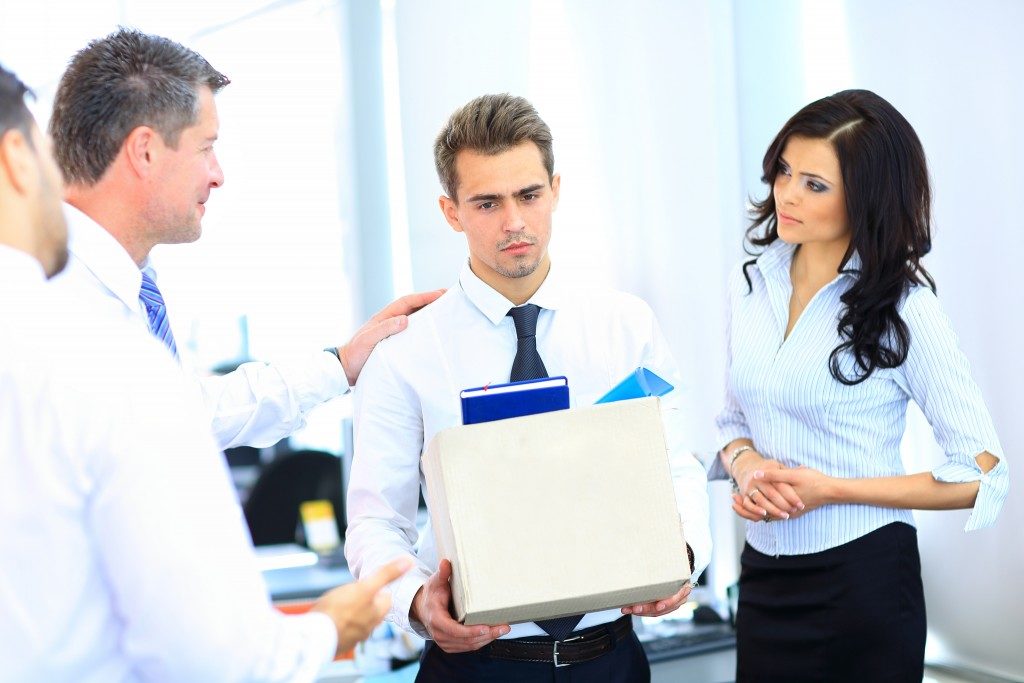 Dismissed businessman carrying things