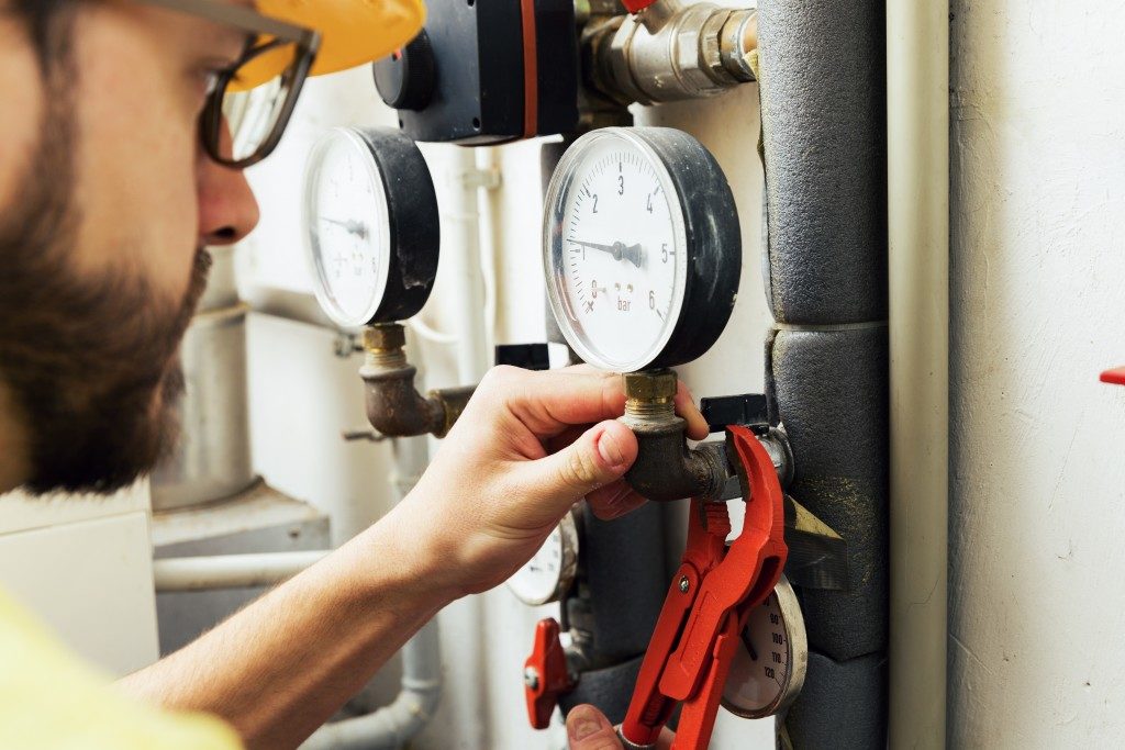 Man fixing flow meter