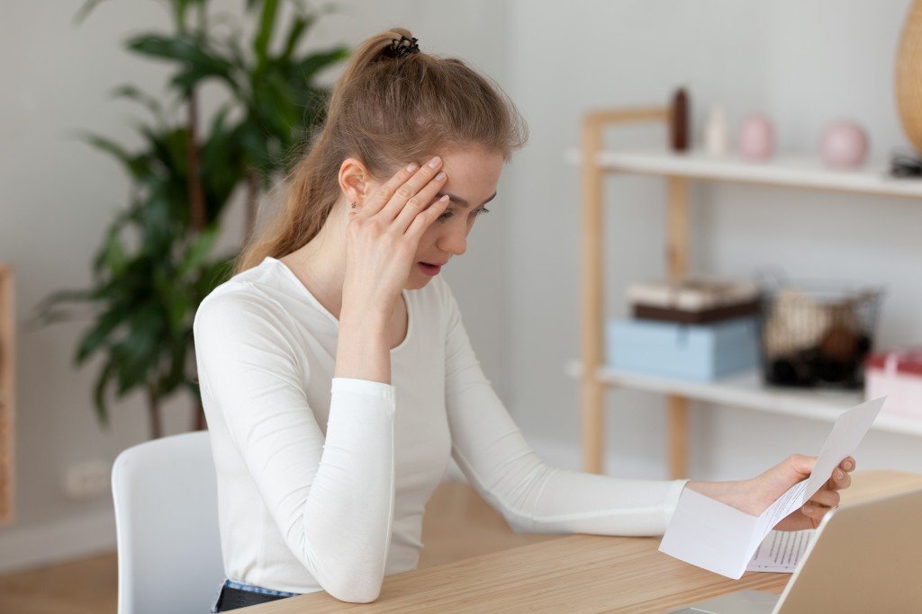 young woman frustrated by the letter