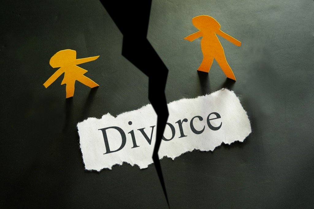 torn piece of paper with divorce written on it