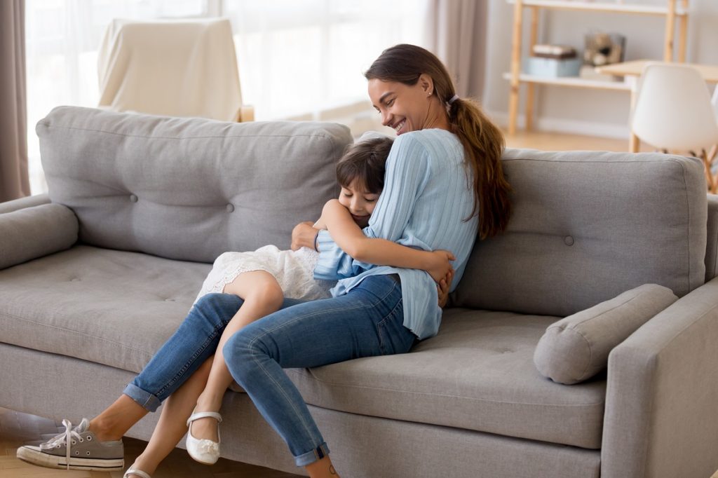 mother and daughter in couch