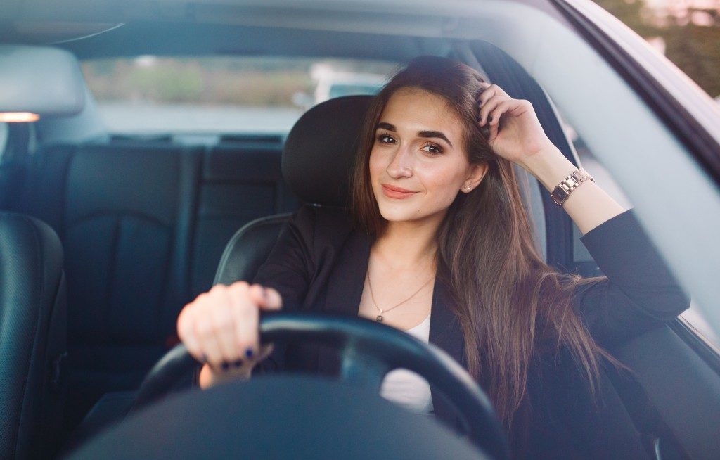 smiling woman in the car