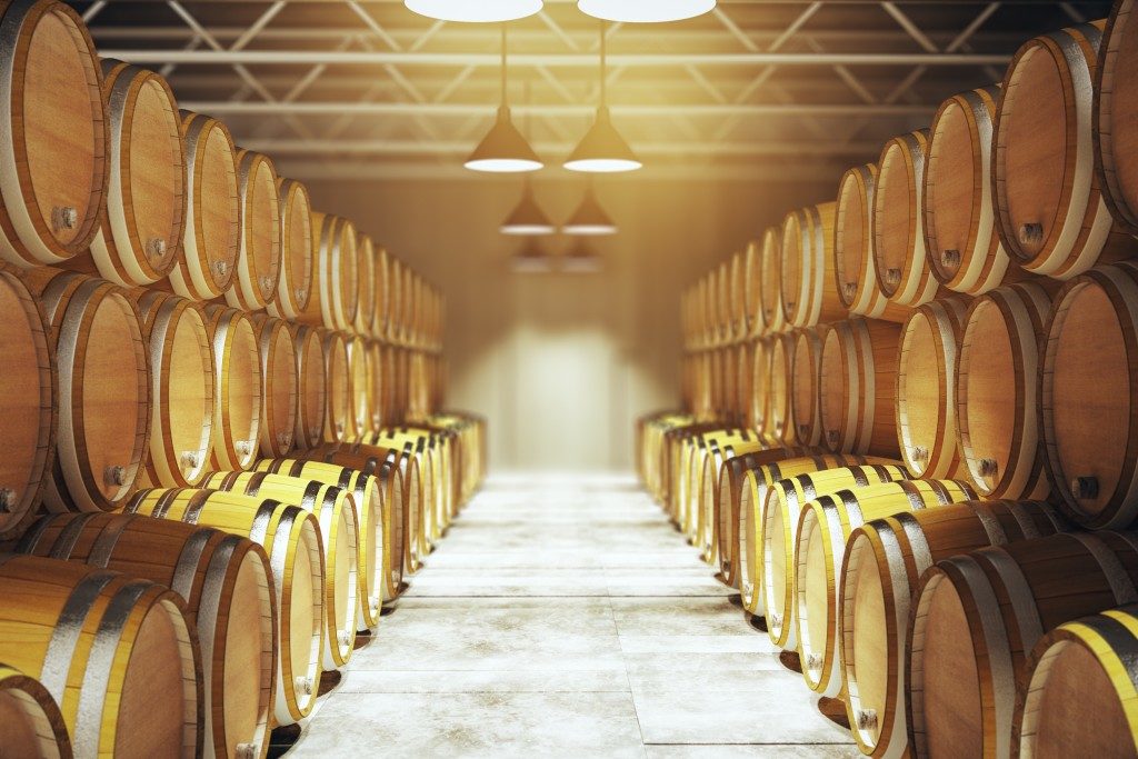 Numerous wooden barrels in winery