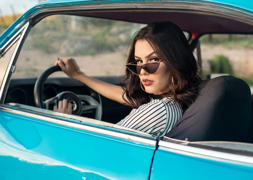 woman with sunglasses driving